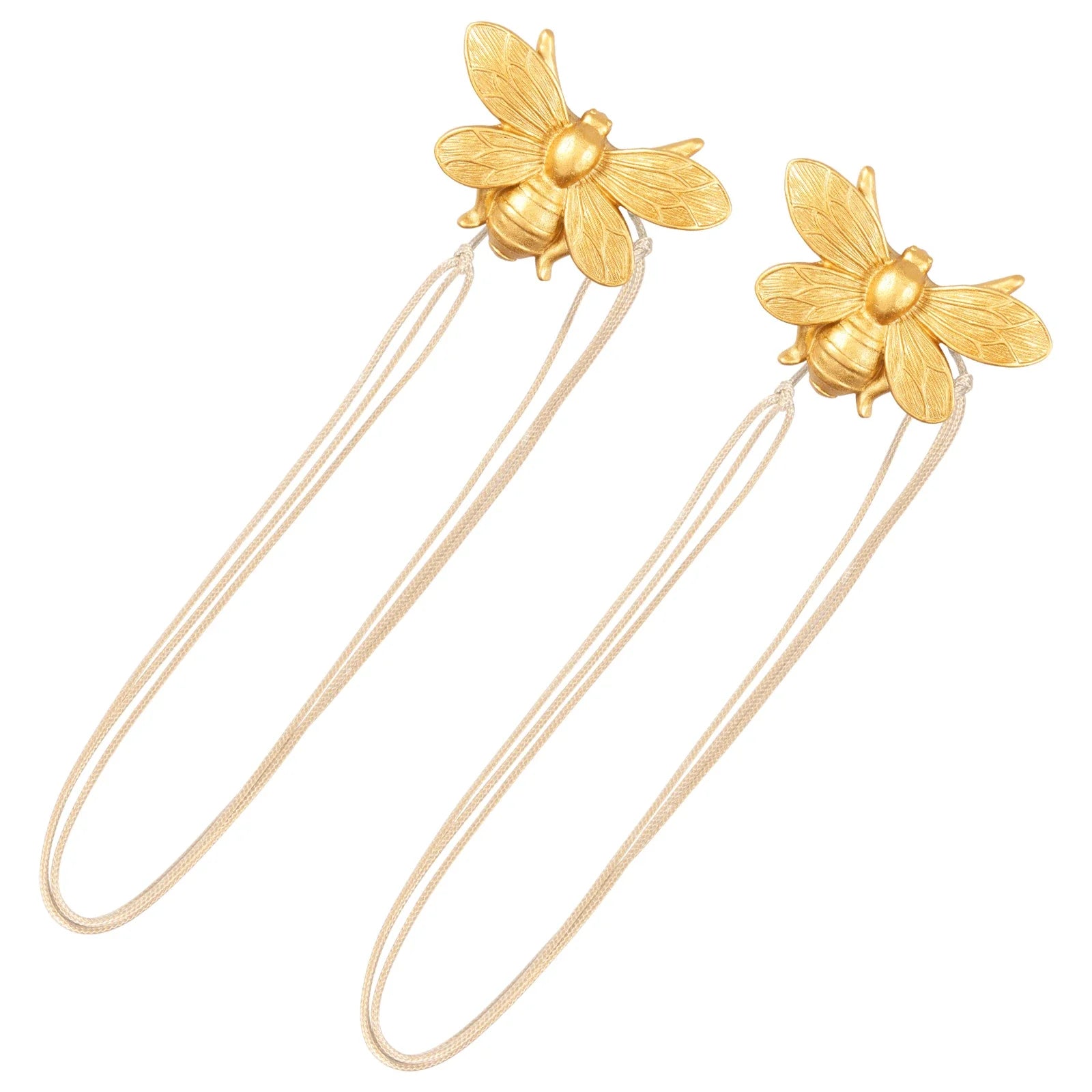 Gold magnetic curtain tiebacks with bee designs on a white background
