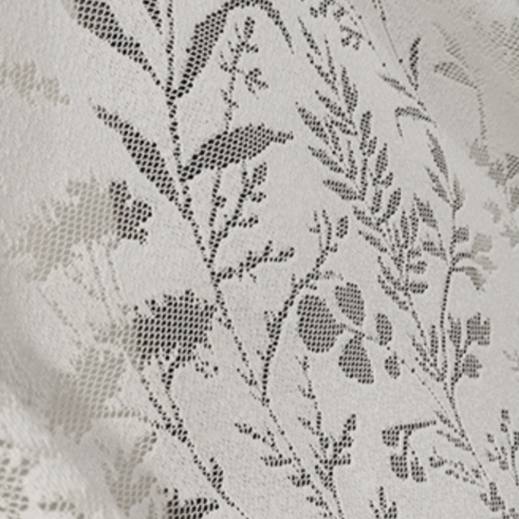 Close-up of floral lace white sheer curtains