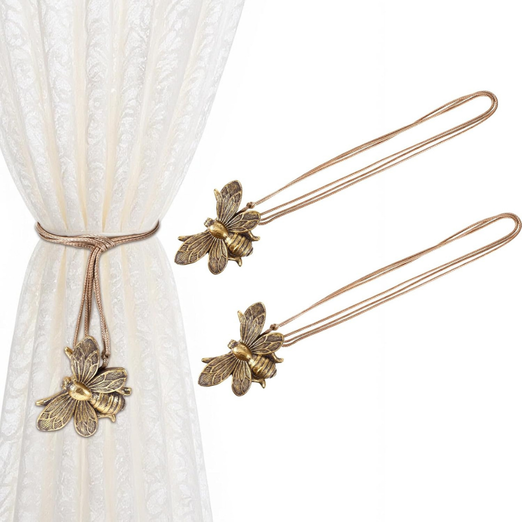 Bee-shaped curtain tiebacks on a white background