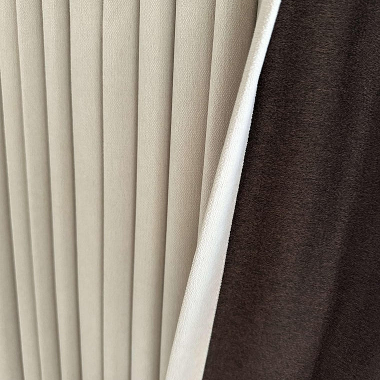 Close-up of beige pleated blackout curtains