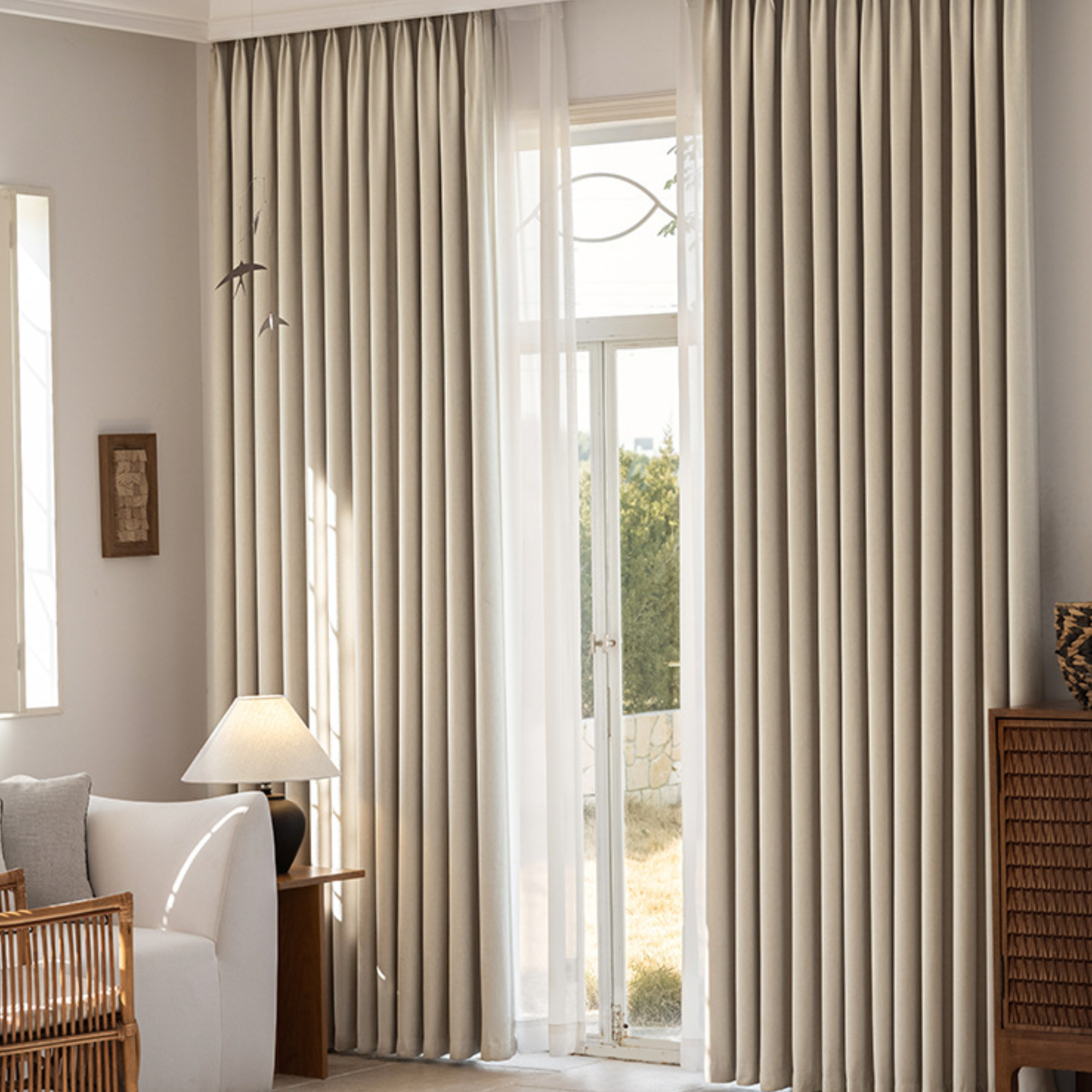 Beige curtains in a living room with a lamp and chair.