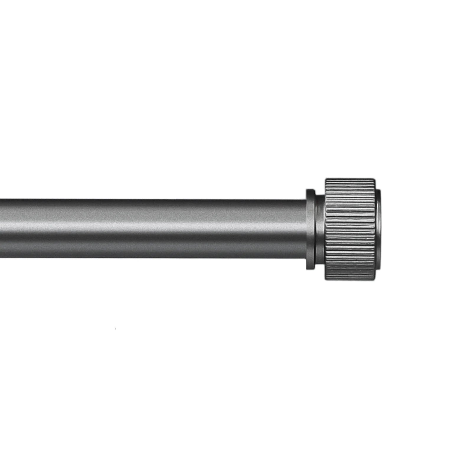 Metal curtain rod with a knurled end on a white background