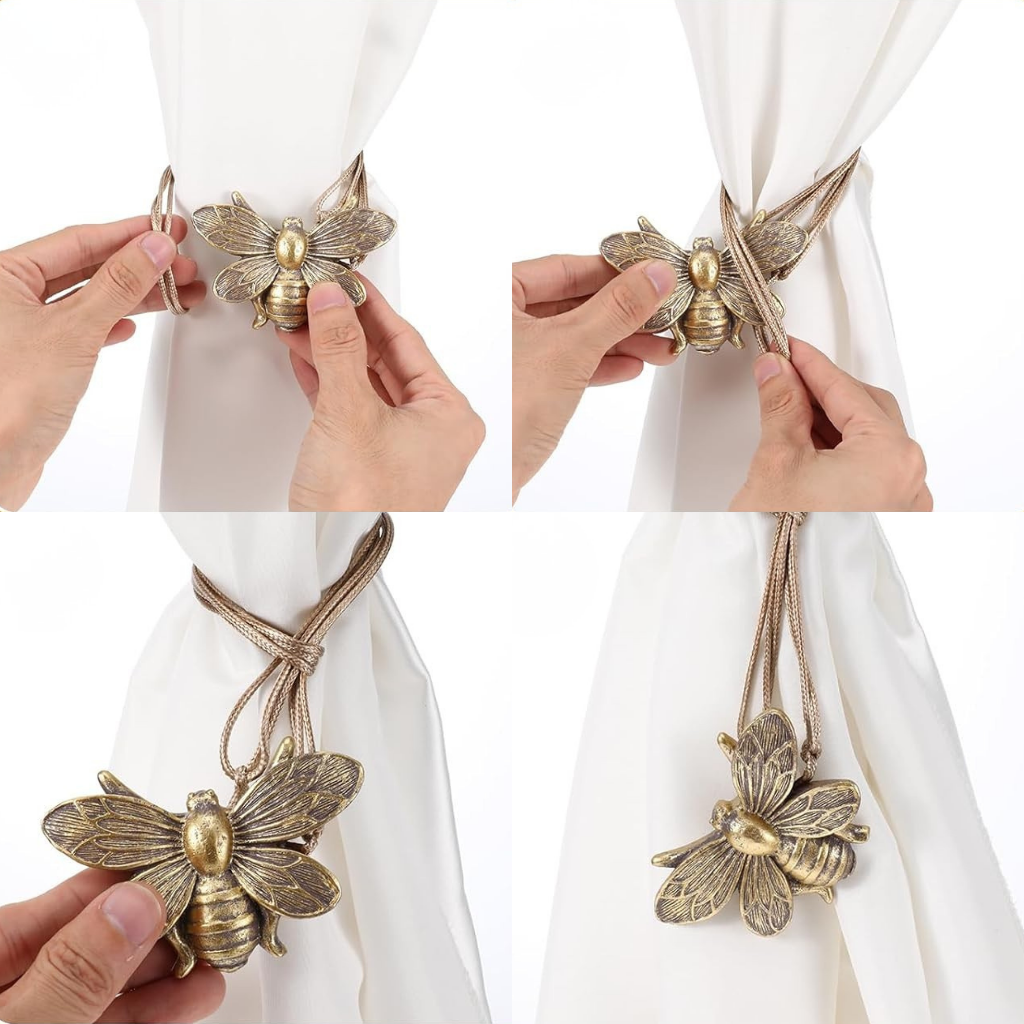 bumble-bee-shaped curtain tiebacks being used on white curtains.