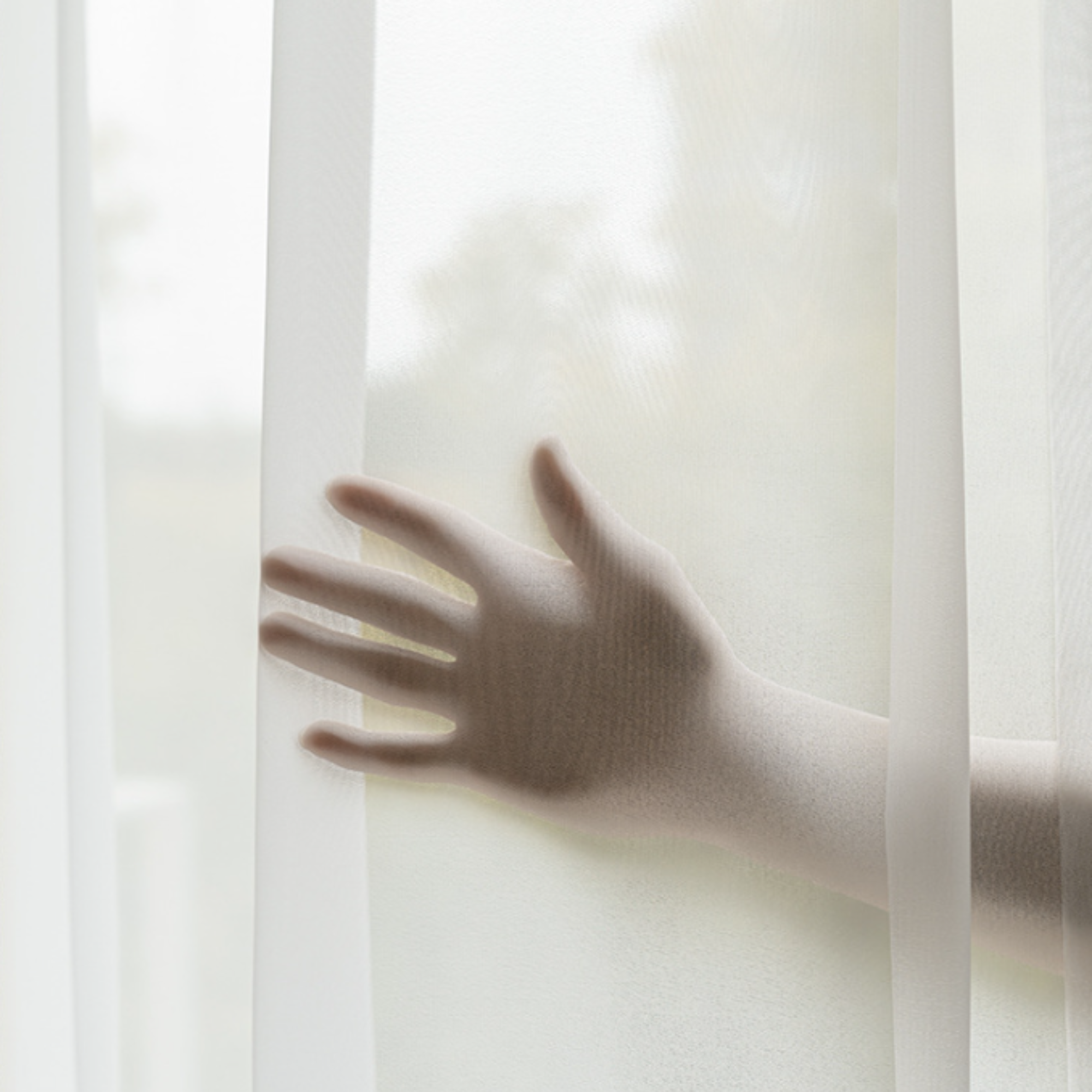 Hand reaching through a sheer white curtain