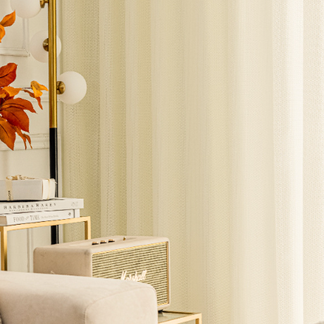 Cream color sheer curtains in living room
