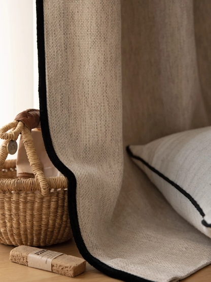 Close-up of custom room darkening curtains in cream.