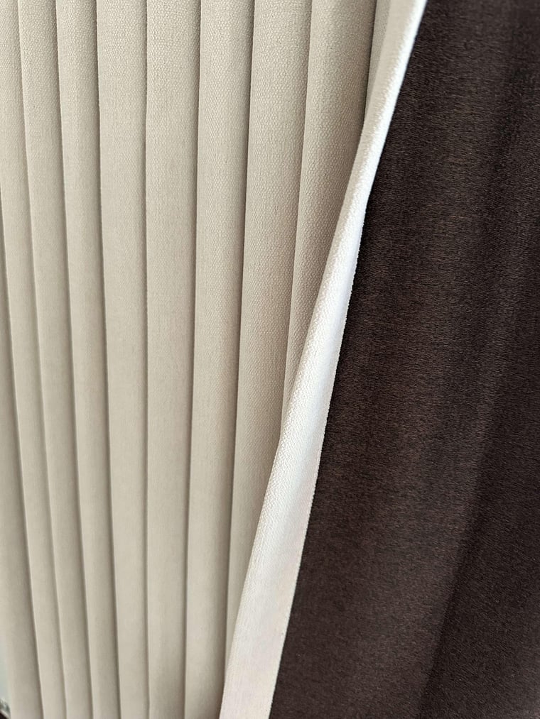 Close-up of beige pleated blackout curtains