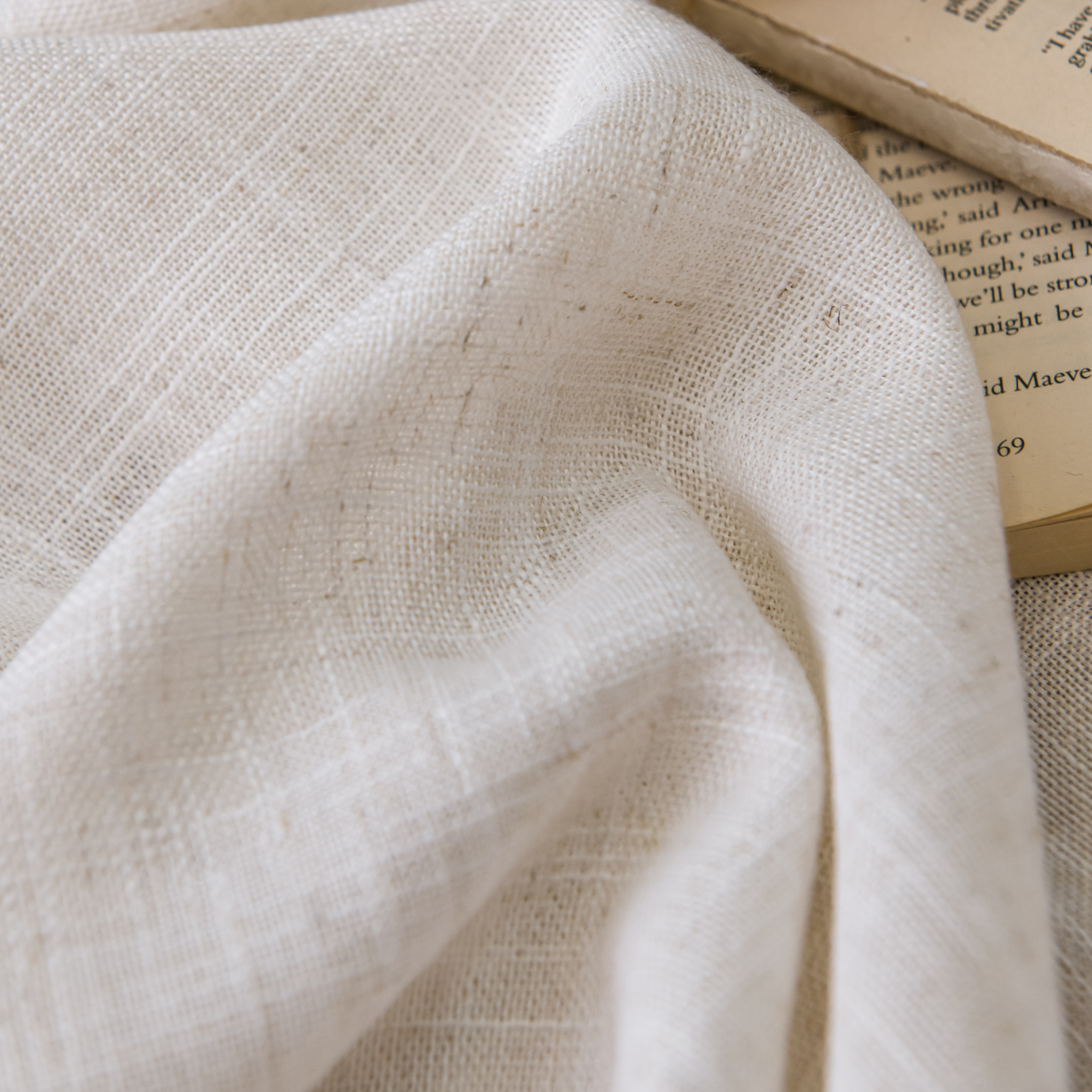 Close-up of the intricate weave of a linen sheer curtain