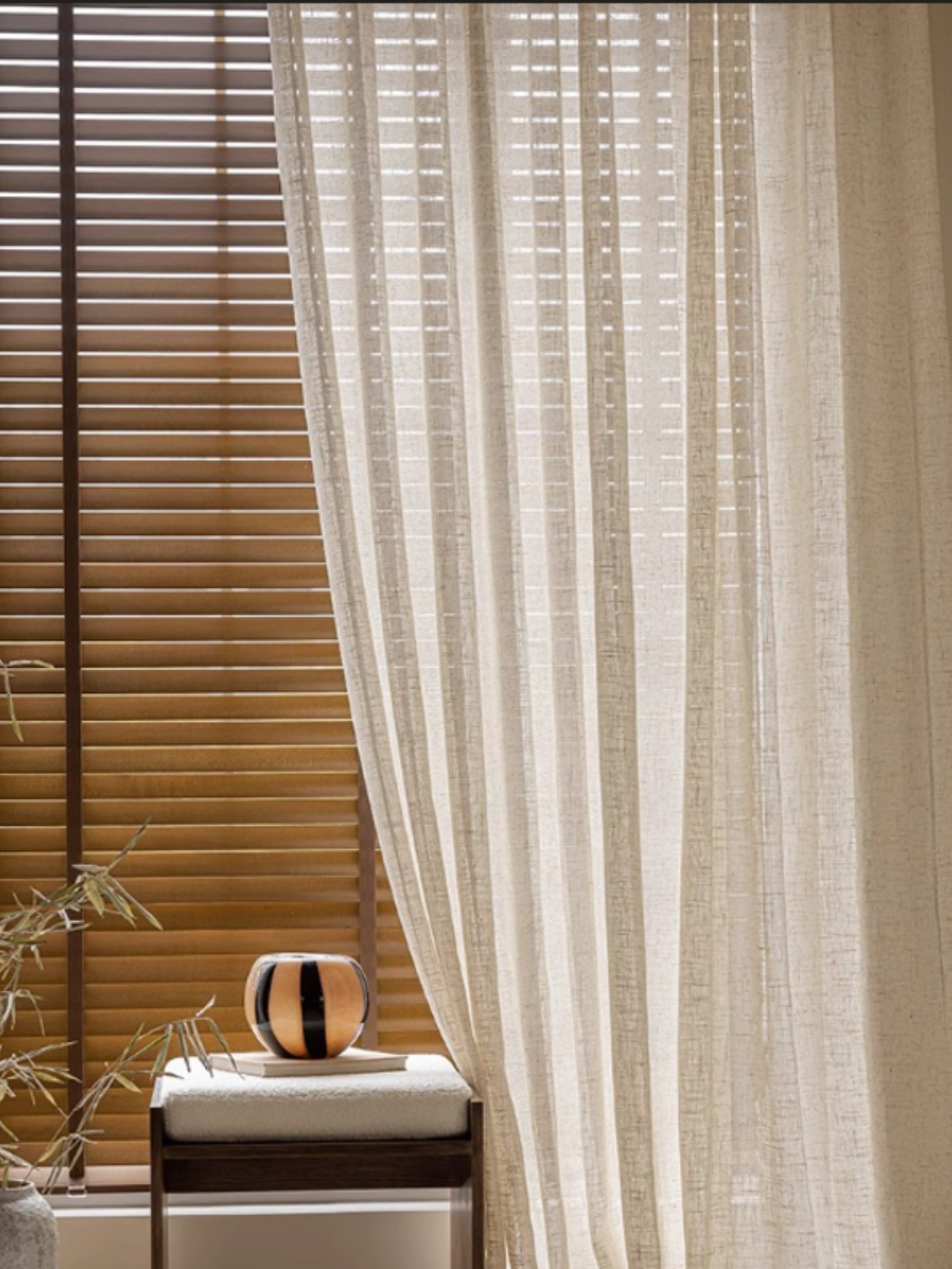 Flowing linen sheer curtains in a natural off-white color