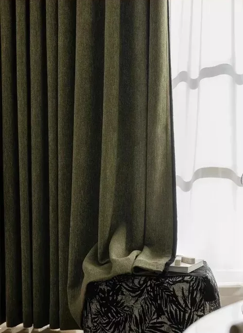 Elegant olive green room darkening curtains enhancing the decor of any living room.