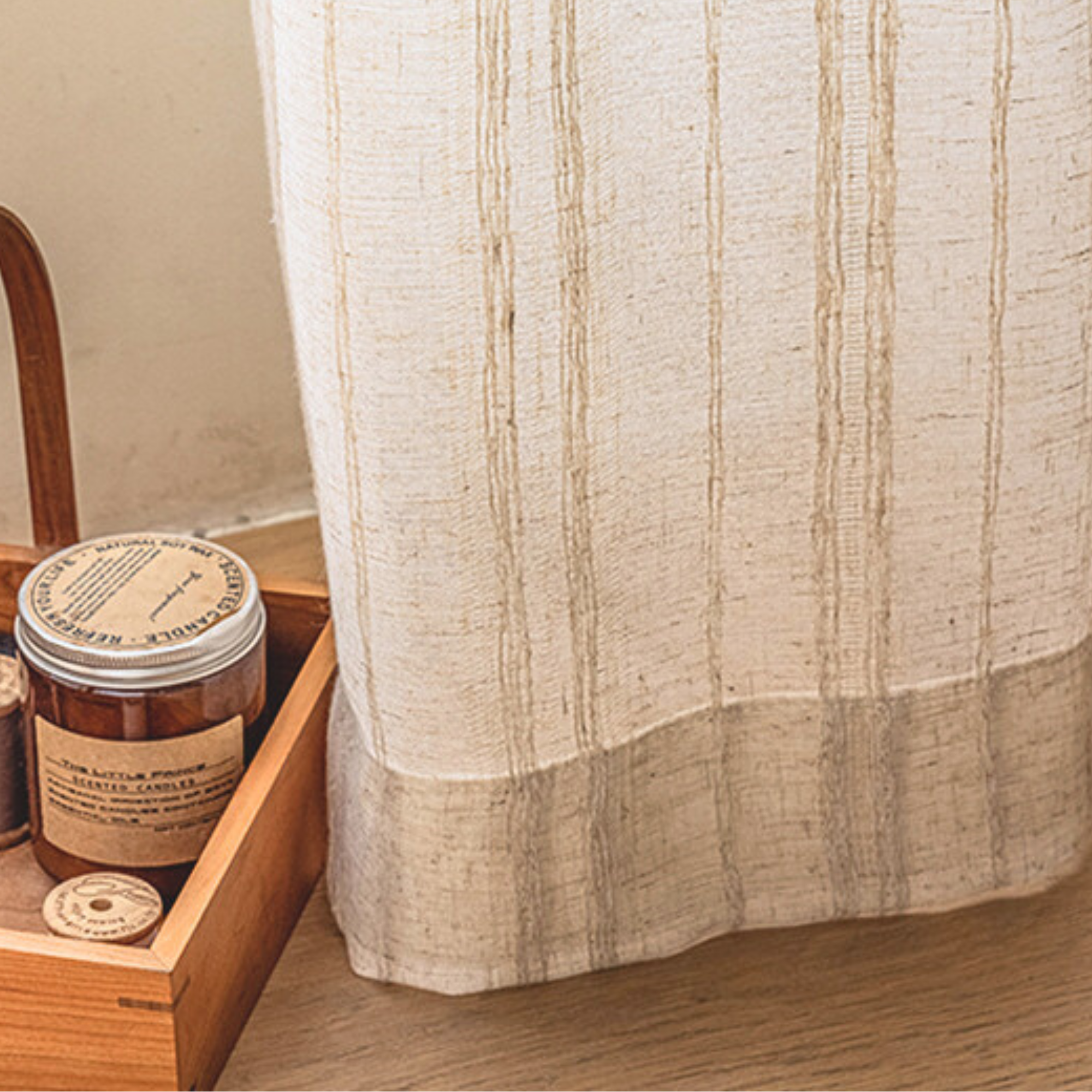 textured beige linen curtain with bottom hem detail